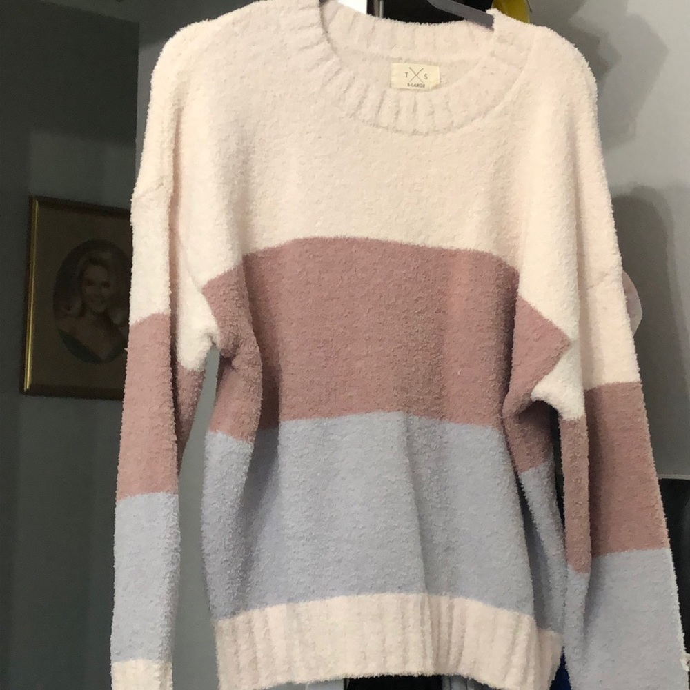 New with tags cream light blue and tan in color soft fluffy sweater never worn